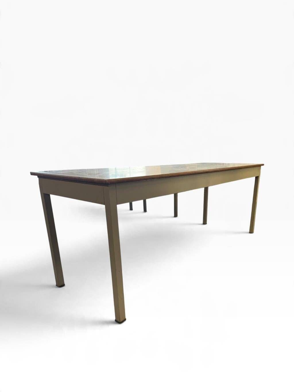 Vintage industrial table with a Formica top and wooden accents.
