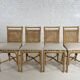 Suite de 4 chaises en rotin cannage et laiton