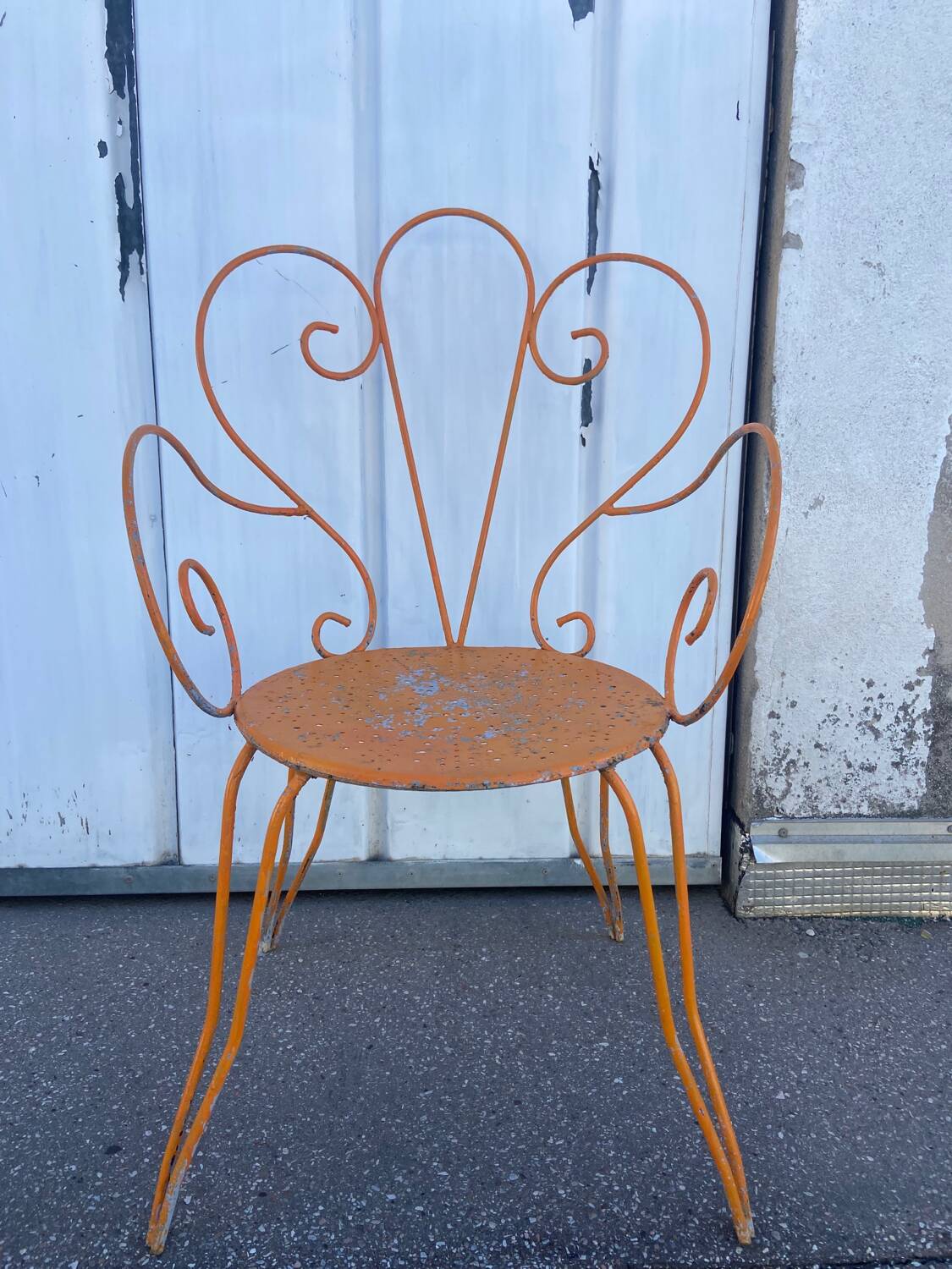 Orange wrought iron chair