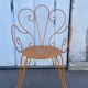 Orange wrought iron chair