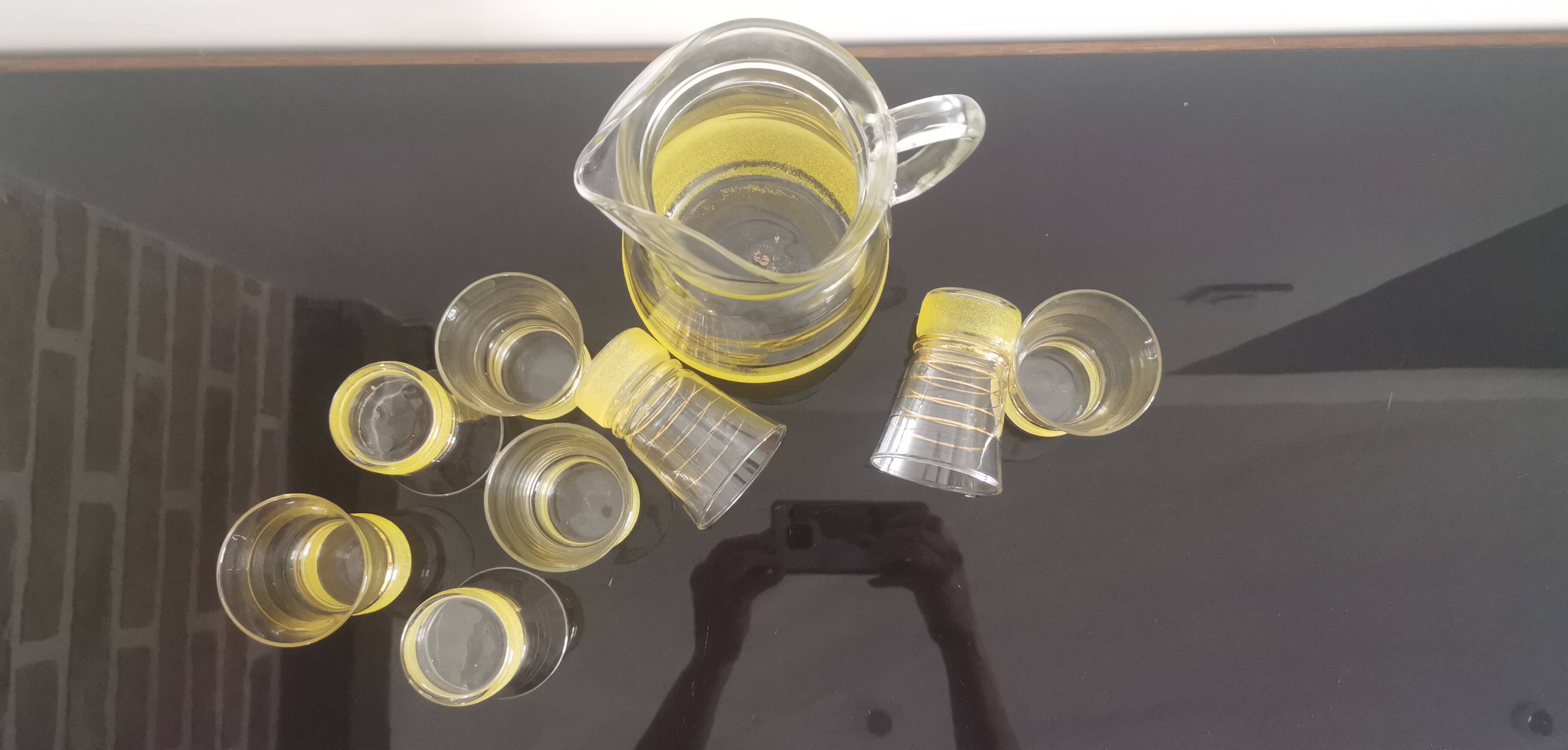 Old pitcher with its 8 yellow granite glasses with gold edging vintage 50's