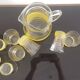Old pitcher with its 8 yellow granite glasses with gold edging vintage 50's