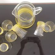 Old pitcher with its 8 yellow granite glasses with gold edging vintage 50's