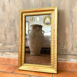Antique gilded mirror from the Directoire period, 19th century.