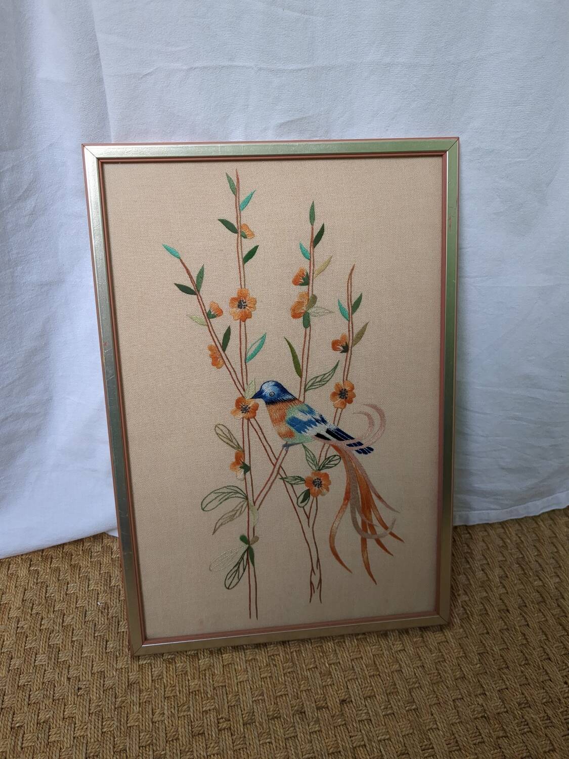 Embroidered picture blue and orange bird