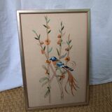 Tableau brodé oiseau bleu et orange