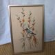 Tableau brodé oiseau bleu et orange