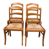4 wooden dining chairs with rush seats and ladder back from the 1970s.
