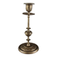 Antique candlestick with patinated brass decorations.