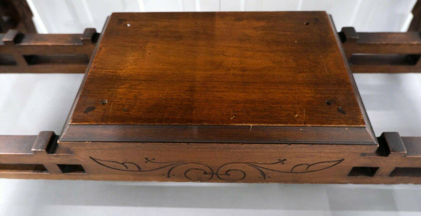 19th-century carved walnut desk with a leather top.