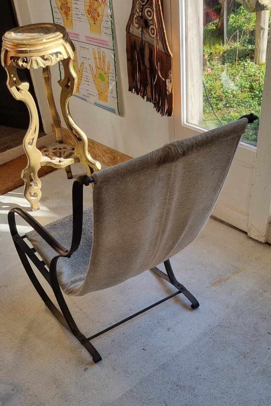 Wrought iron and skin armchair