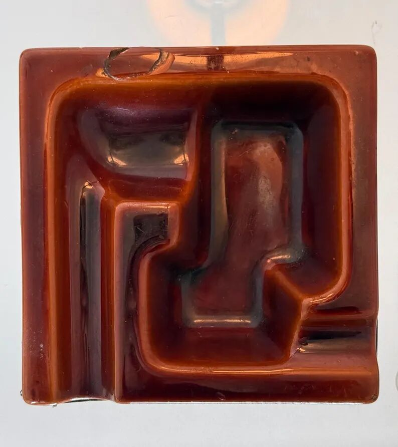 Geometric brown enamelled ashtray with a leather base (1960s-70s)