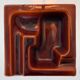 Geometric brown enamelled ashtray with a leather base (1960s-70s)