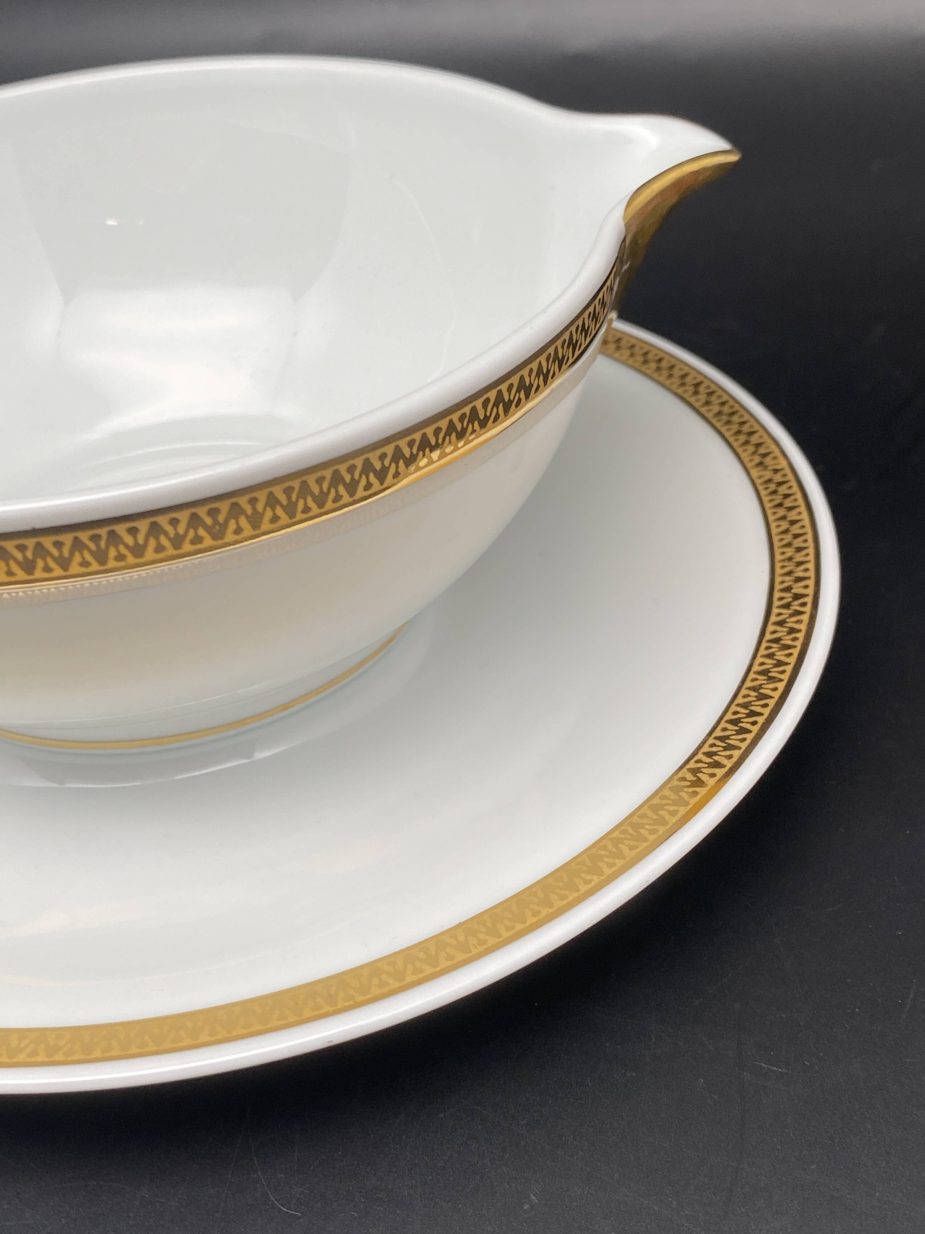 Limoges porcelain gravy boat with gold edging