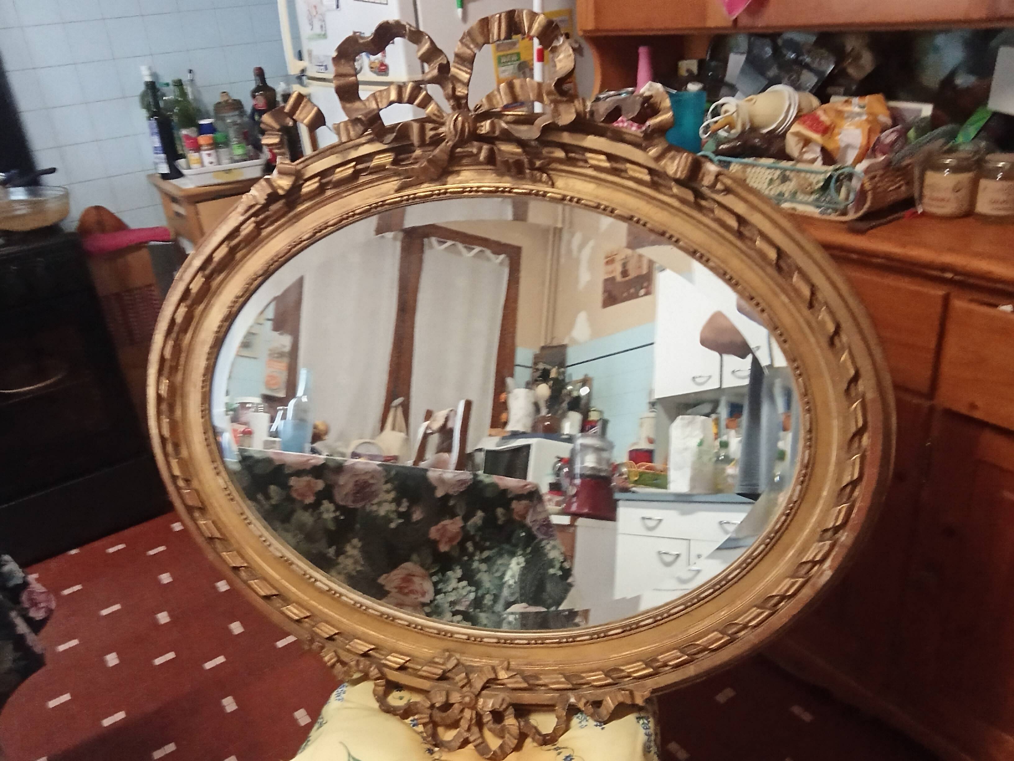 Golden leaf medallion mirror.