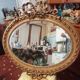 Golden leaf medallion mirror.