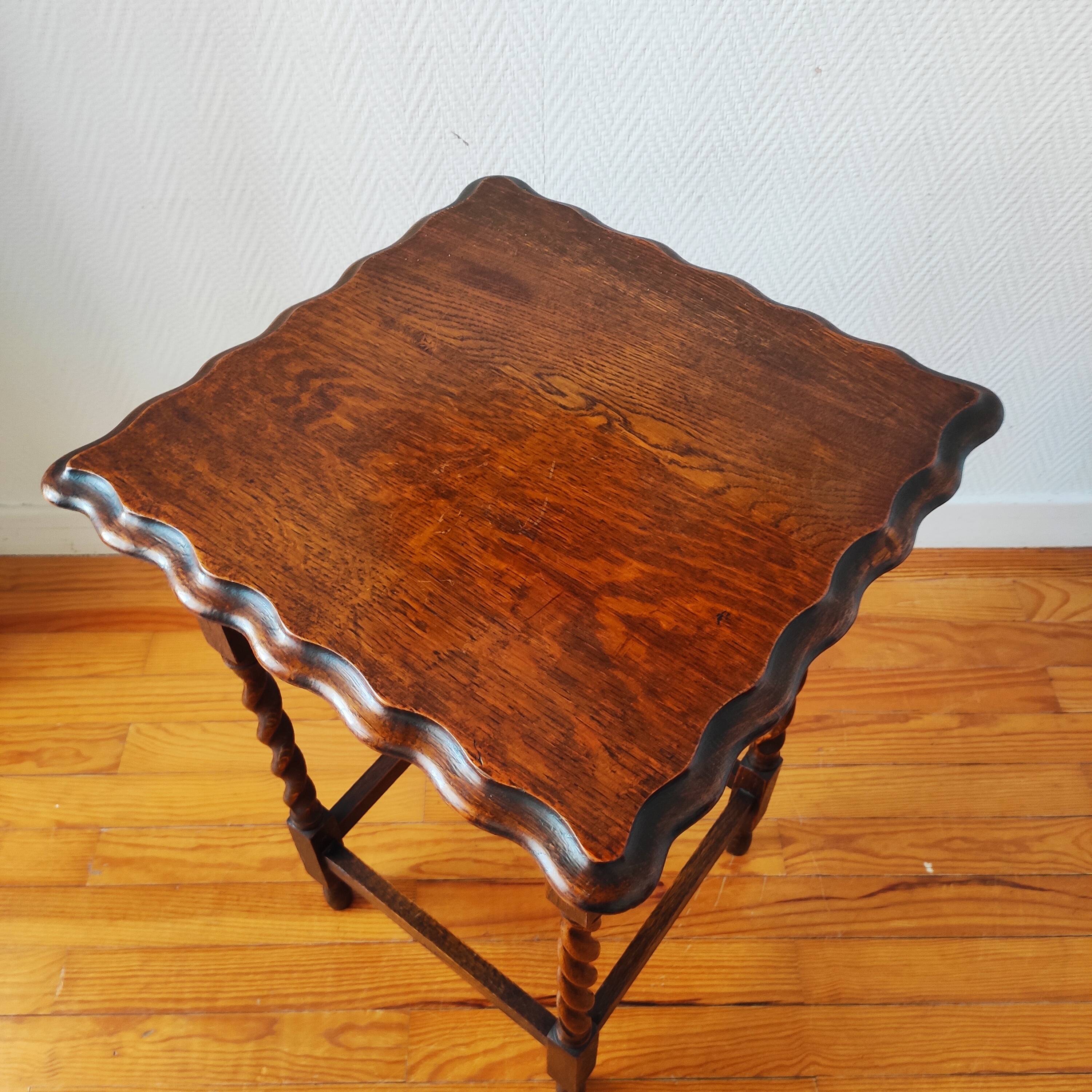 Antique solid oak side table with turned wooden legs.