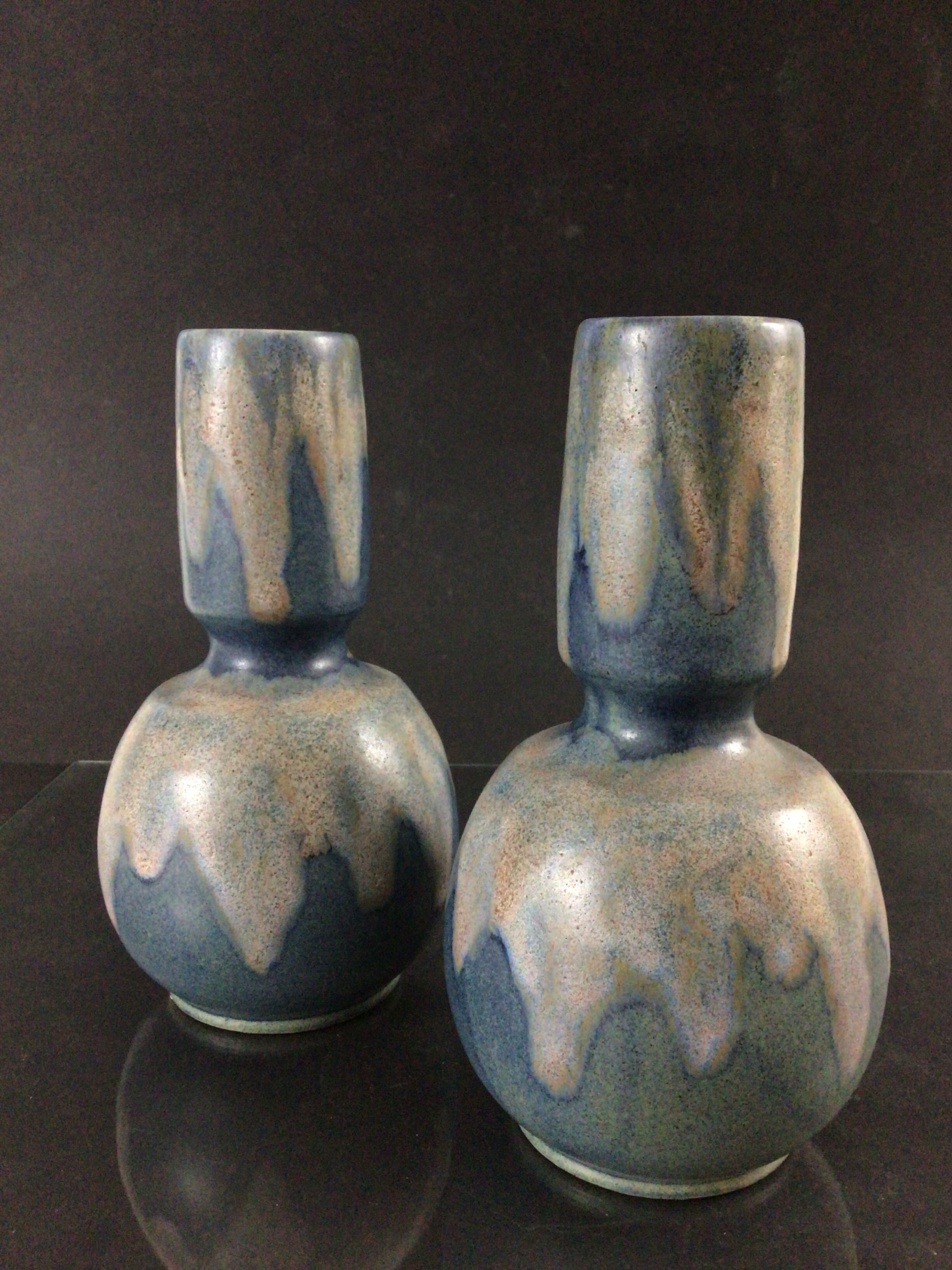 Pair of sandstone vases signed Lebret