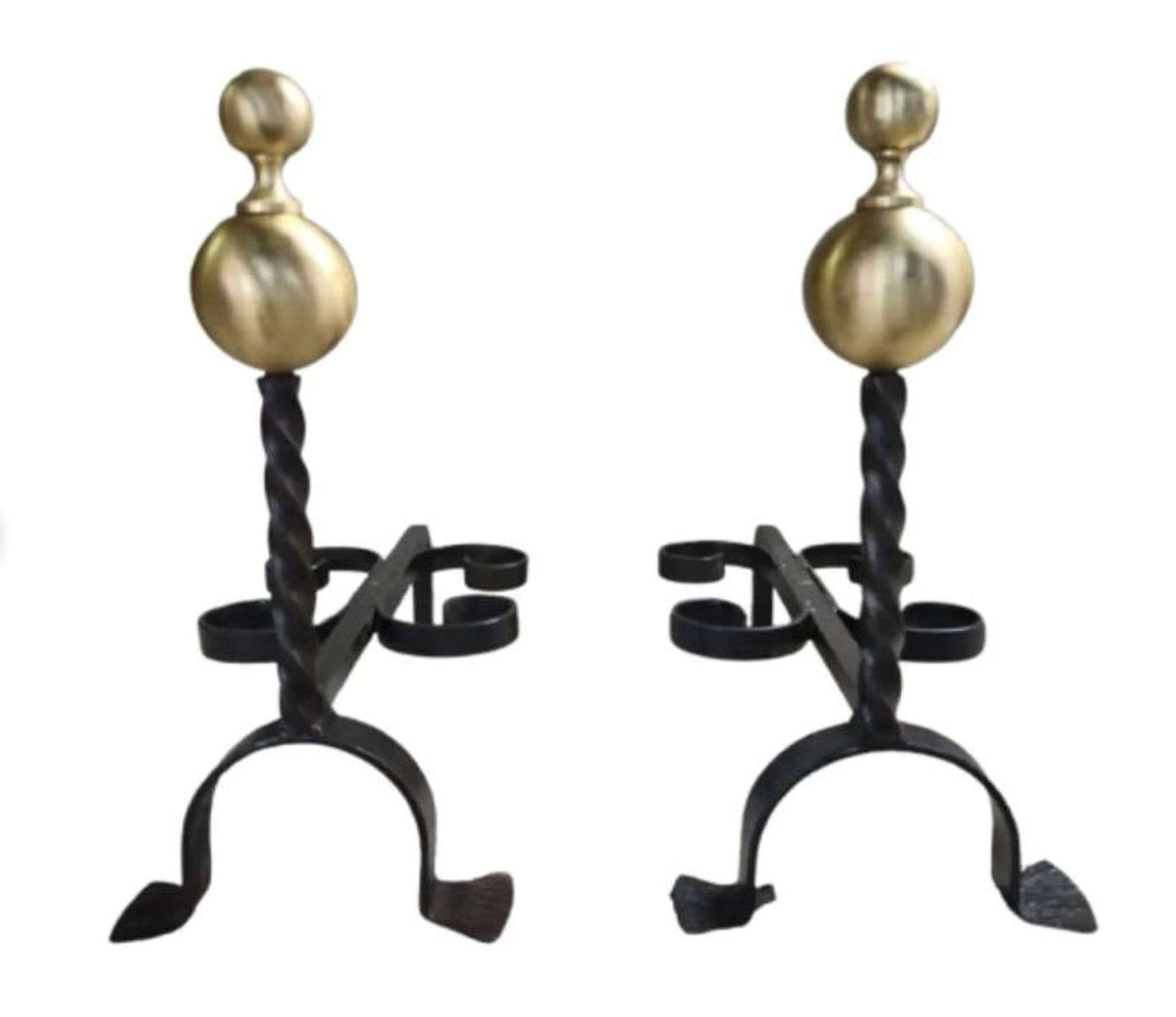 Pair of wrought iron candlesticks with cast bronze ball, 1970s.