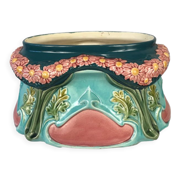 Jardinière en barbotine polychrome à décor de guirlande de fleurs