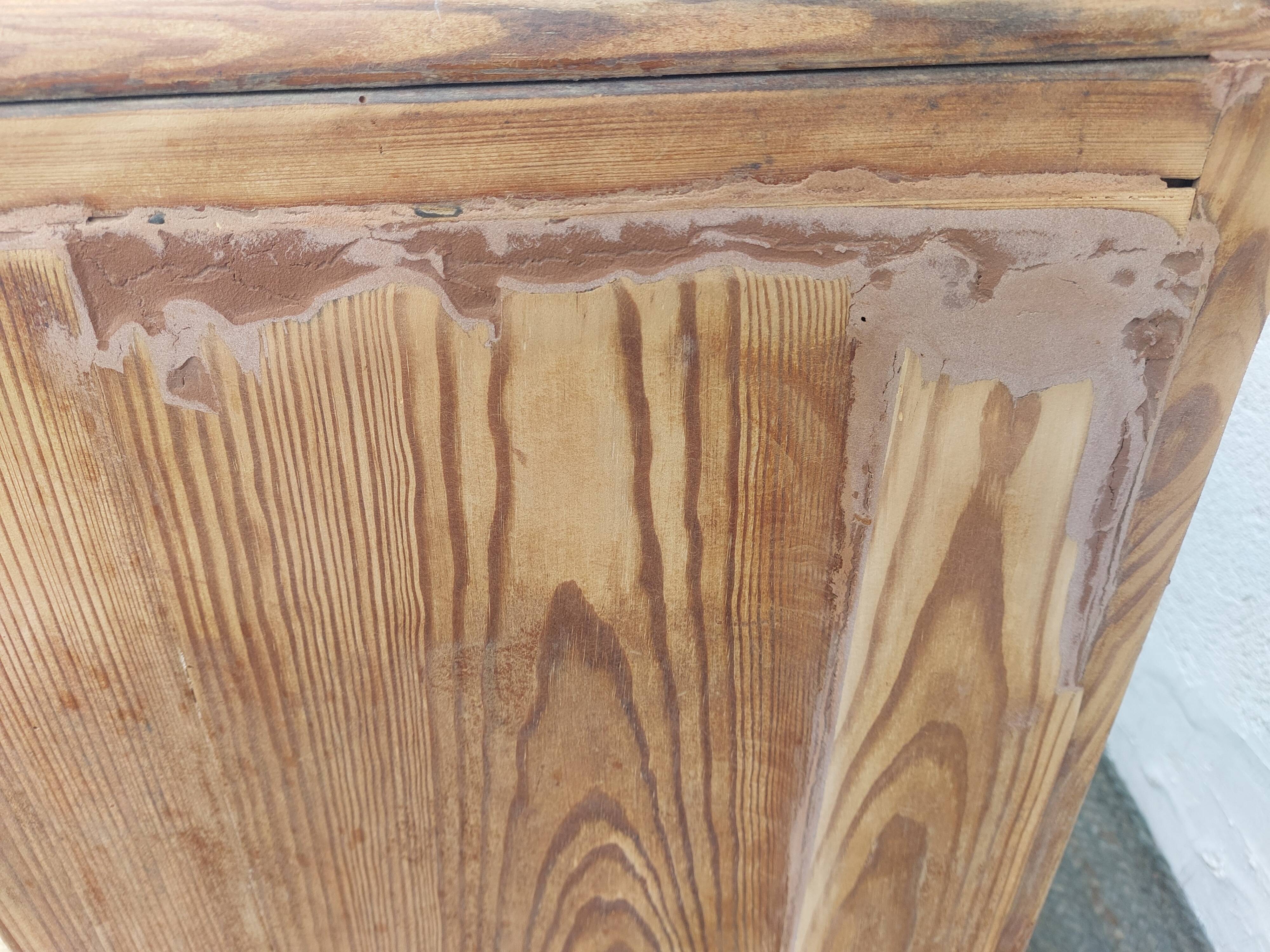 Vintage wooden buffet with a marble top.