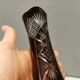 Crystal glass vase, in burgundy/reddish coloured glass with translucent details.