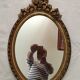 Miroir ovale en bois doré 52 x 35 cm