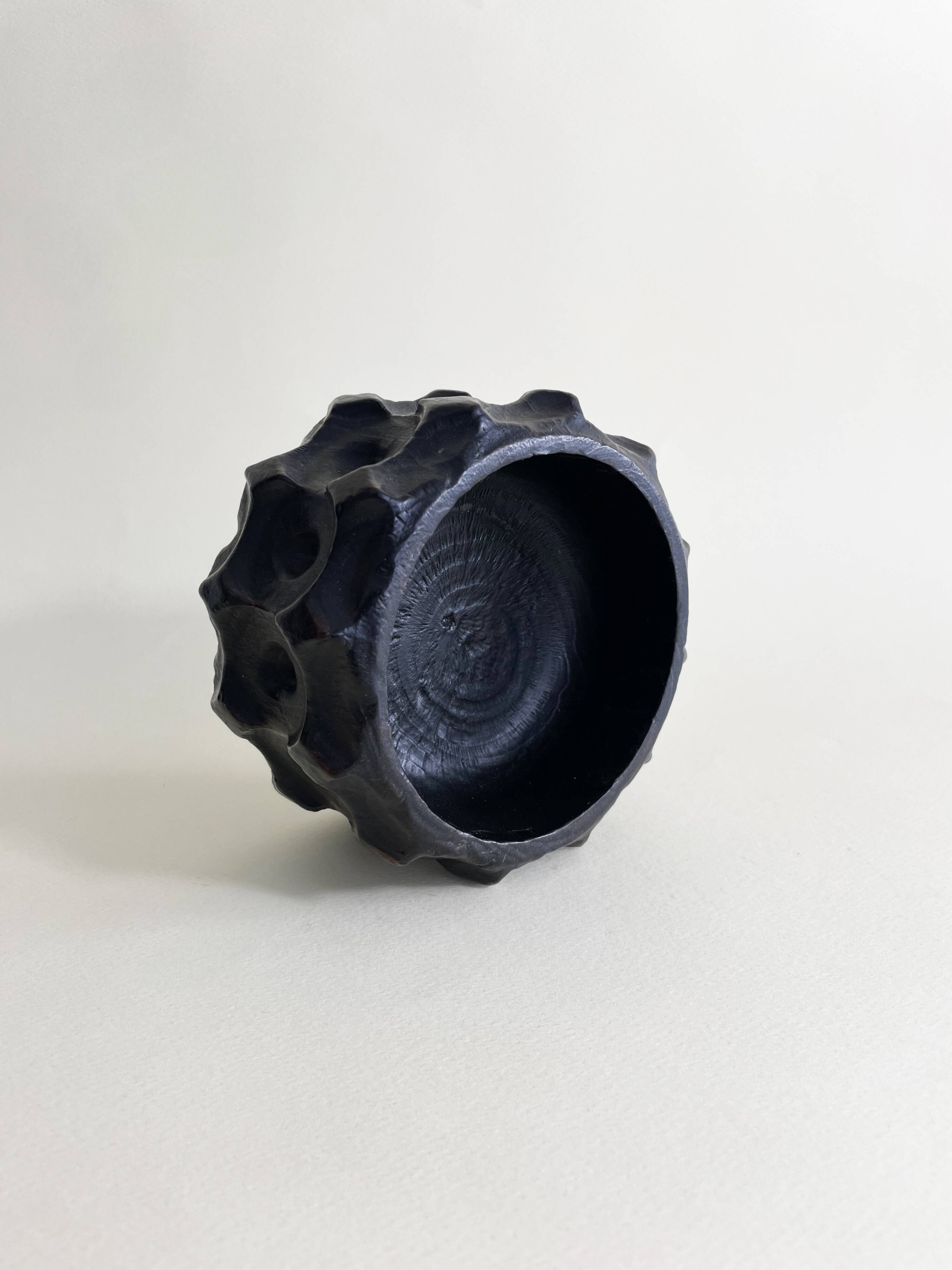 Brutalist wooden pocket emptier