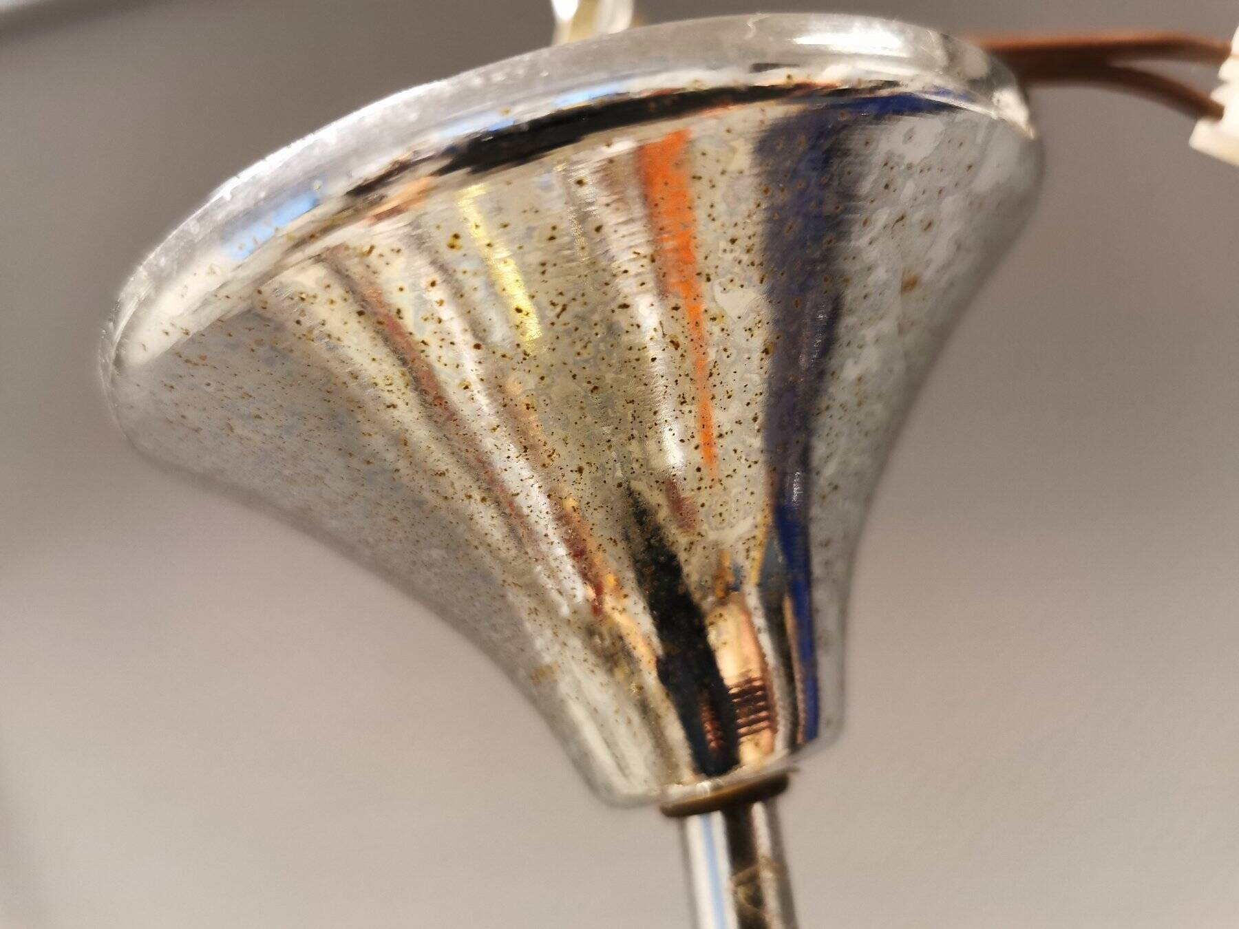 Hanging lamp in chromed metal with orange contrast lacquer and three light sources.
