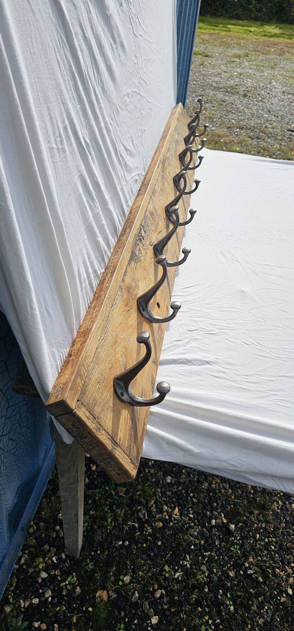 Teak coat rack with 8 double cast iron hooks