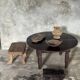 Antique round coffee table in Indonesian teak with turned legs.