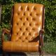 Fauteuils en bois et cuir capitonné, les 2