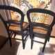 Pair of 2 chairs with cane seats in black wood, circa 1940