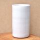 Vase by Antonio Lampecco minimalist white ceramic scroll