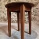 Antique round side table with oak legs and a pine top, circa 1900.