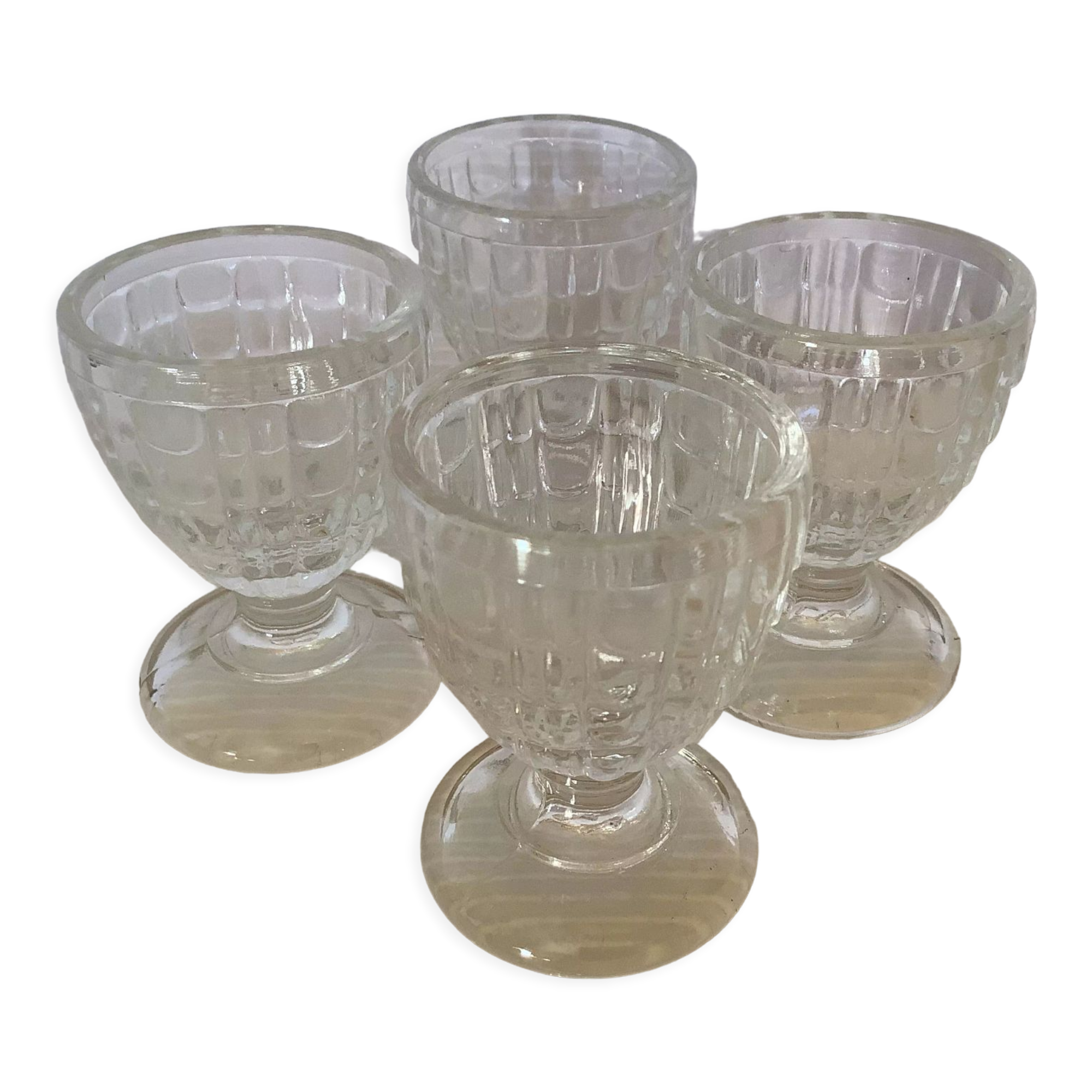 Four old molded glass shells