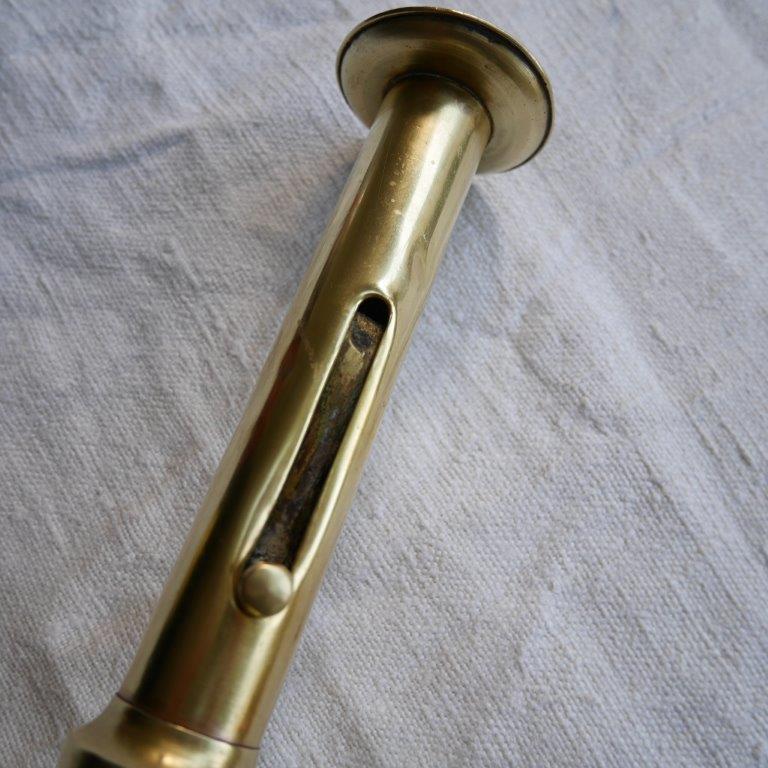 Brass candle holder with pusher