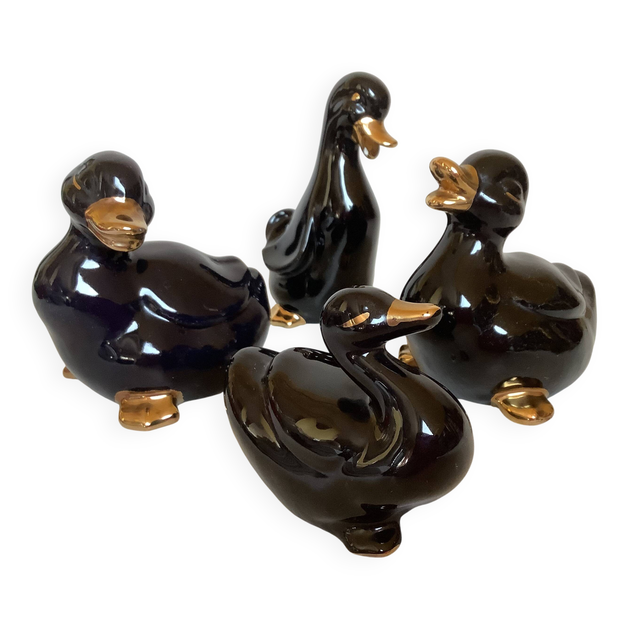 Four little black and golden ducks.