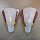 Pair of brass wall lights in Mid Century Modern style attributed to Stilnovo.