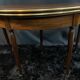 A Louis XVI period mahogany half-moon table forming a console/games table