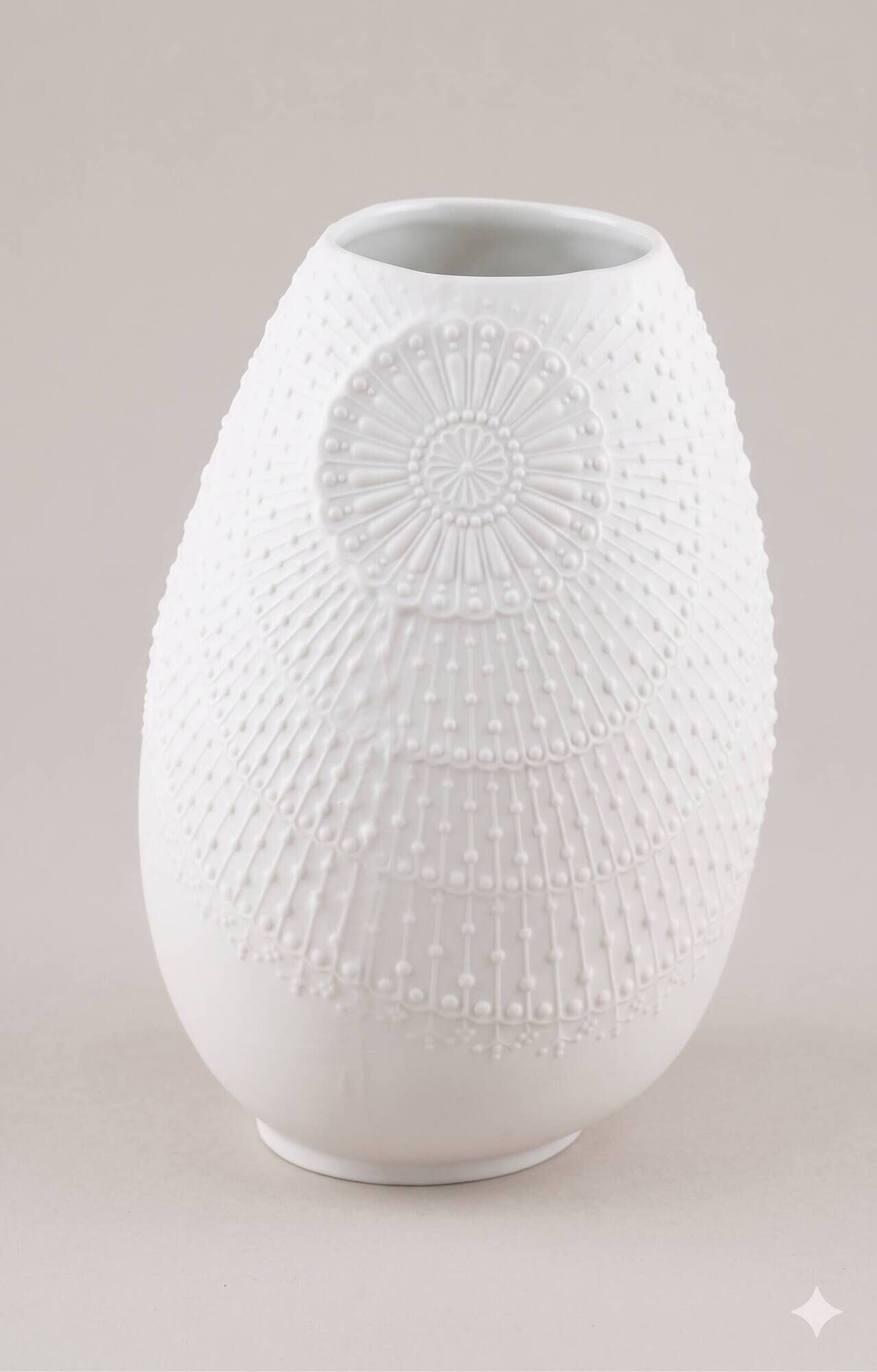 Biscuit porcelain vase by Kaiser, relief decoration, op art design.