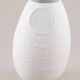 Biscuit porcelain vase by Kaiser, relief decoration, op art design.