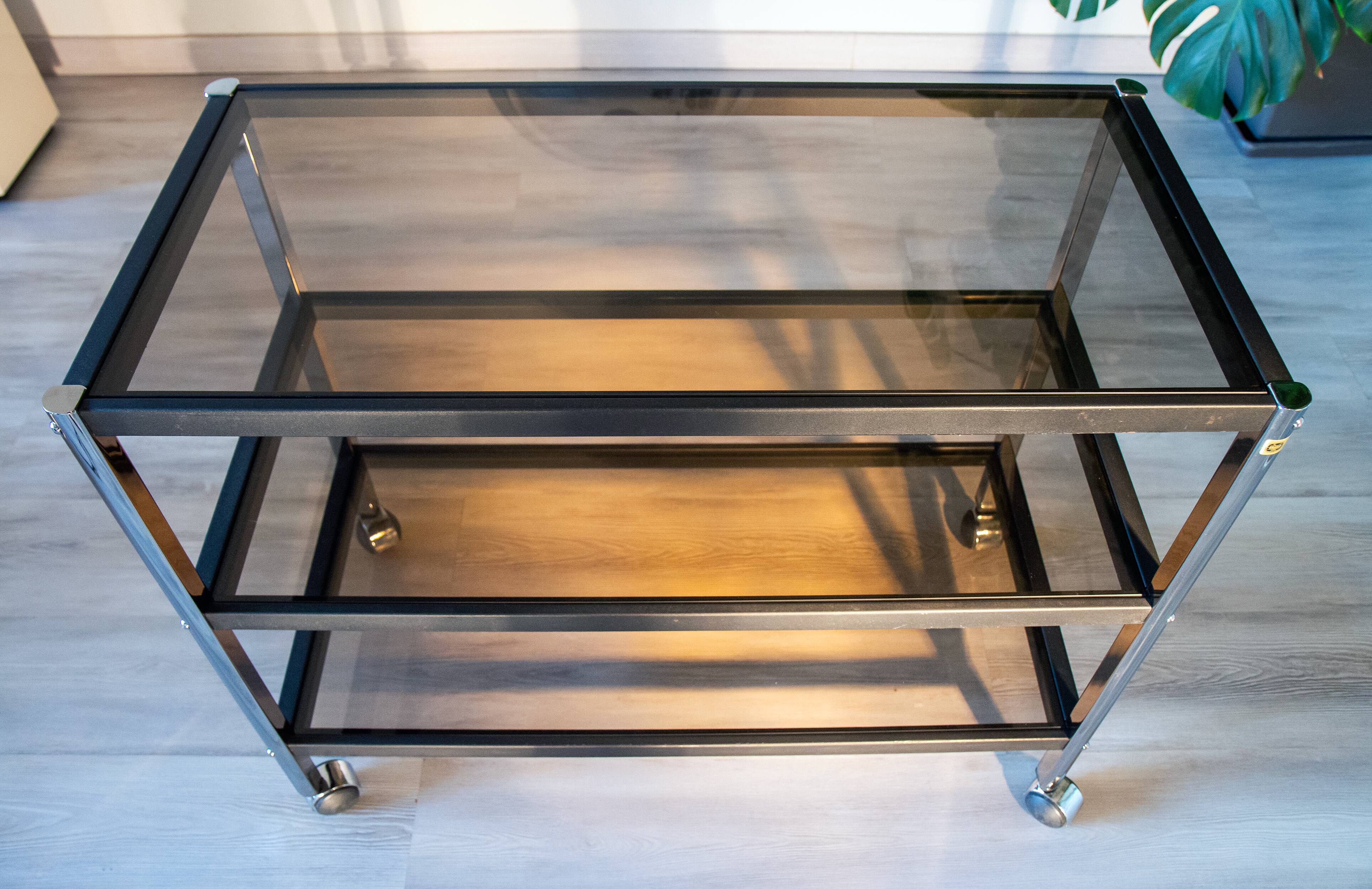 ERARD console (France), black metal and smoked glass side table, 1980.
