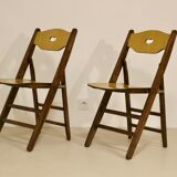Pair of vintage folding chairs year 50 sculpted backrest.