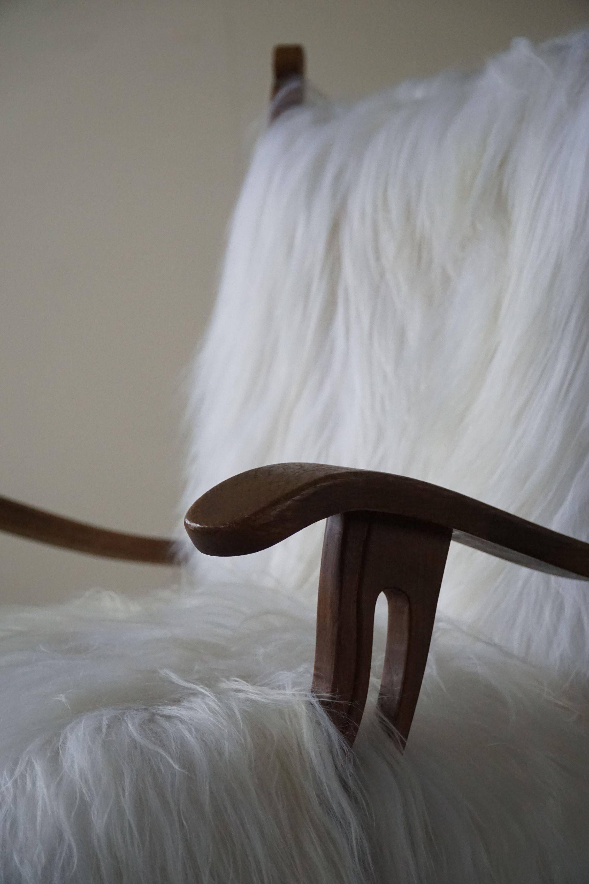 Henning Kjærnulf, armchair reupholstered in long-haired Icelandic sheepskin, 1950