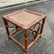 Vintage square stool in bamboo, rattan, and wicker.
