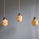Art Deco trio of suspensions in opaline and marbled ouraline, Scailmont, 1920-30.