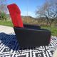 Vintage armchairs in red and black faux leather, the pair.