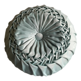 Round pleated satin cushion