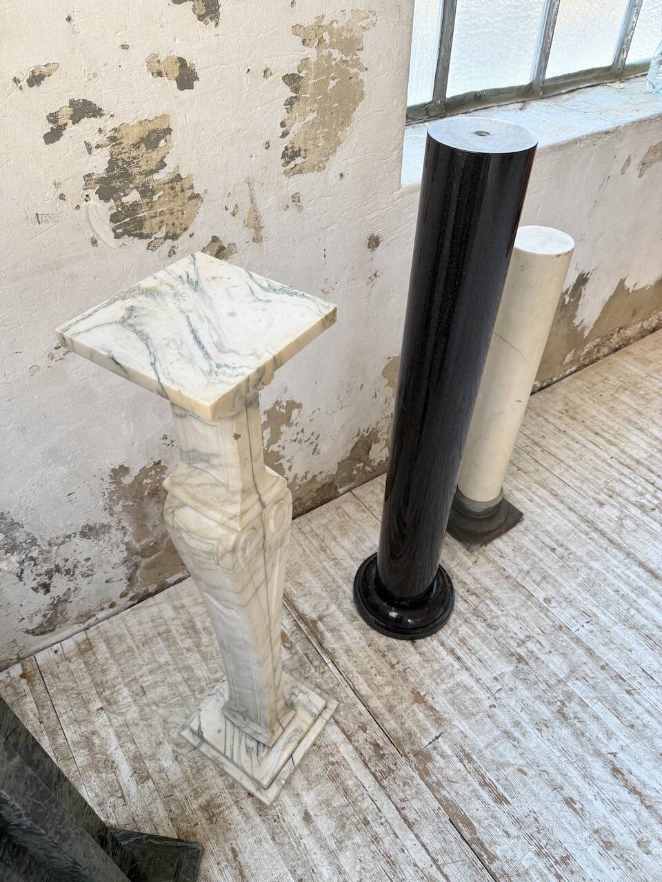 Set of 4 marble columns or pedestals.